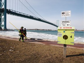 Windsor firefighters continue the search after reports of two persons in the water near Assumption Park on the Windsor riverfront, on Jan. 31, 2018.