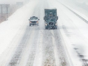 WINDSOR, ON. FEBRUARY 9, 2018. -- Vehicles travel on the snow covered westbound lanes of the 401 Highway near Windsor on Friday, February 9, 2018 during a day long snowfall. (DAN JANISSE Ð The Windsor Star) CRUISER