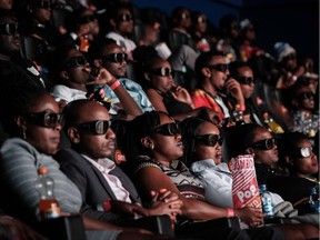 Invited guests watch the film "Black Panther" in 3D which featuring Oscar-winning Mexico born Kenyan actress Lupita Nyongo during Movie Jabbers Black Panther Cosplay Screening in Nairobi, Kenya, on Feb. 14, 2018. Black Panther is a Superhero film based on the Marvel Comics character featured the first black superhero as Black Panther in advanced fictional African nation.