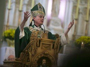 Bishop Ronald P. Fabbro presides over the 150th anniversary mass at St. Alphonsus Parish in downtown Windsor on Sept. 6, 2015.