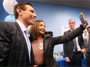Ontario PC leadership candidate Patrick Brown attended on Saturday, February 24, 2018, the opening of the campaign headquarters of Windsor Tecumseh PC candidate Mohammad Latif. Jannine Ambrosio snaps a selfie with Brown during the event.