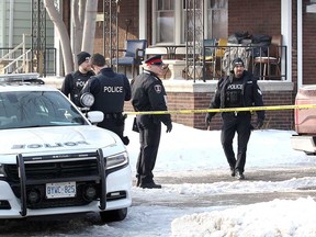 Windsor police officers investigating the 900 block of Church Street where the body of 16-year-old Chance Gauthier was found on the morning of Feb. 14, 2018. Gauthier died from a gunshot wound.