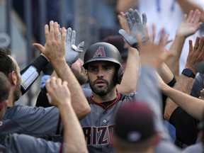 Will players heed a call for a spring training boycott made by an agent? Many free agents, including Arizona Diamondbacks' J.D. Martinez, remain unsigned with two weeks before camps open.