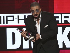 In this Nov. 20, 2016, file photo, Drake accepts the award for favorite artist - rap/hip-hop at the American Music Awards at the Microsoft Theater in Los Angeles.