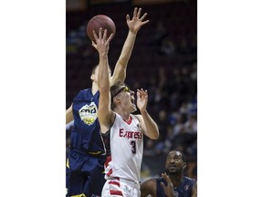 Windsor Express forward Logan Stutz takes the ball to the basket while being defended by St. John's Wally Ellenson in NBL of Canada action on Monday at the WFCU Centre