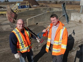 City of Windsor employees David Girard, left, and Jim Leether dug through a mound of garbage to help a new father recover an envelope containing a substantial amount of money. They are shown at the city's waste transfer station on North Service Road on Feb. 28, 2018.