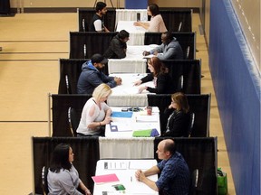 Employment counsellors speak with job seekers at a job fair at the WFCU Centre on Oct. 13, 2017. According to Statistics Canada, Windsor's jobless rate fell to 4.6 per cent in January 2018.