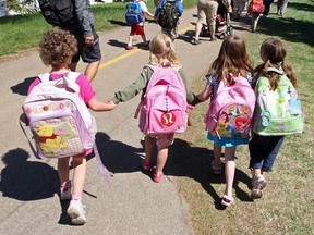 Kindergarten students from Robina Baker school make their way around the International Children's Festival in St. Albert, Alta., on May 27, 2009.