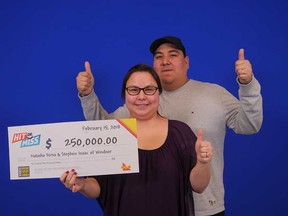 Natasha and Stephen Yerxa give thumbs-ups after receiving their $250,000 prize cheque from playing the new OLG game Hit or Miss, February 2018.
