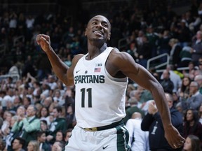 FILE - In this Dec. 30, 2016, file photo, Michigan State's Tum Tum Nairn celebrates the team's 61-52 win over Northwestern in an NCAA college basketball game, in East Lansing, Mich. No. 2 Michigan State can seal a share of the Big Ten title with a win Tuesday night against Illinois at home, where three seniors will come off the bench in their last game at the Breslin Center.