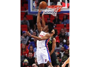 Detroit Pistons forward Stanley Johnson (7) drives on Atlanta Hawks guard Tyler Dorsey (2) in the first half of an NBA basketball game in Detroit, Wednesday, Feb. 14, 2018.