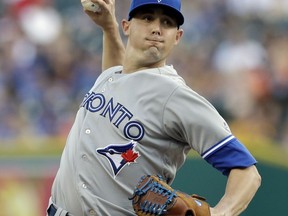 FILE - In this July 14, 2017, file photo, Toronto Blue Jays starting pitcher Aaron Sanchez throws during the first inning of a baseball game against the Detroit Tigers, in Detroit. Forget about Josh Donaldson's home run total, or Marcus Stroman's fastball velocity. The most important digit being measured at Blue Jays spring training is the middle finger on Aaron Sanchez's right hand.