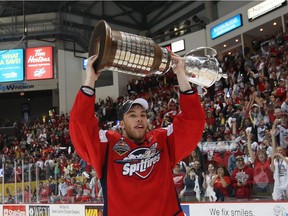 Taylor Hall hoists the Robinson Cup after helping the Windsor Spitfires defeat the  Barrie Colts to win the Ontario Hockey League Championship  at the WFCU Centre in 2010.