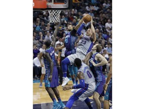 Charlotte Hornets' Michael Carter-Williams (10) blocks Detroit Pistons' Blake Griffin (23) shot during the first half of an NBA basketball game in Charlotte, N.C., Sunday, Feb. 25, 2018.
