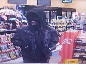 Windsor police are seeking a masked man who robbed a convenience store on Mill Street in the city's west end on Feb. 18, 2018. The robber wore distinctive, bright red shoes.