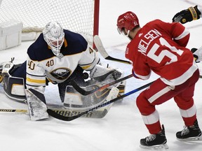 Buffalo Sabres goaltender Robin Lehner (40), of Sweden, makes a save on Detroit Red Wings center Frans Nielsen (51), of Denmark, during the third period of an NHL hockey game, Thursday, Feb. 22, 2018, in Detroit. The Sabres defeated the Red Wings 3-2 in overtime.