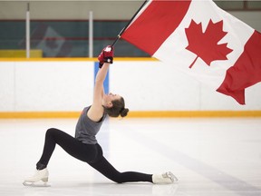 Elizabeth Elliott, 16, a member of the South Windsor Skating Club, practices with the Canadian flag at South Windsor Arena, Wednesday, Jan. 31, 2018.