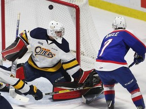 A healthy scratch on Saturday, Windsor Spitfires centre Tyler Angle scores the first of his two goals on Erie Otters goalie Daniel Murphy during Sunday's 7-3 win at the WFCU Centre.
