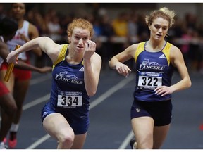 Stephanie Shaw, left, and Kristy Hodgins from the University of Windsor are shown during the 4X400 race on Saturday, February 24, 2018 at the St. Denis Centre in Windsor, ON.