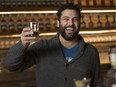 Adriano Ciotoli, owner of WindsorEats, holds up a glass of whisky at the J.P. Wiser's tasting room, in this file photo from Tuesday, February 20, 2018.