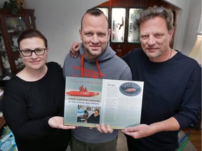 April Wilson, Chris Williams, centre, and Jeff Williams hold a photo of their father Bob Williams on Sunday, February 4, 2018. Bob Williams, a local businessman and member of the Canadian Motorcycle Hall of Fame passed away recently.