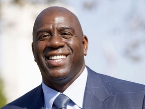 FILE - In a Tuesday, Aug. 23, 2016 file photo, former Los Angeles Lakers star Magic Johnson speaks at a groundbreaking ceremony for a stadium which will be home to the Los Angeles Football Club in Los Angeles.