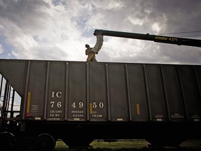 Canadian National says it's mobilizing more train cars and workers to clear a grain backlog.