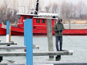 Ezra Weatherman, 14, was hoping to land a pike but happily settled on a string of perch at Lakeview Park Marina on March 13, 2018. Weatherman was fishing with a couple of his high school friends, who are off school during March Break.