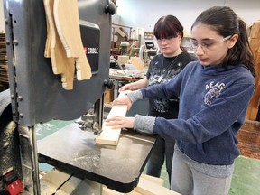 Build A Dream student participants Madison Fenkanyn, left, and Maria Strelkova work in the construction shop on March 13, 2018, during a week-long March Break camp at Riverside high school.