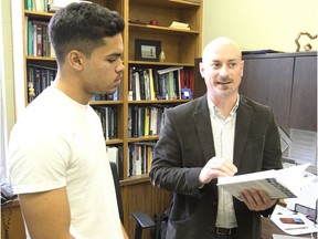 University of Windsor associate professor Dr. Chris Abeare, right, meets with 3rd year psychology student Joseph Burey, 20, on March 13, 2018. Abeare released a study involving concussions and Burey is preparing for honours research on concussions later this year.