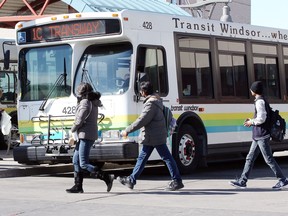 Passengers make their connections with Transit Windsor buses at the downtown terminal on March 16, 2018.