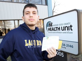 Ali Abouzeeni, 16, shows his letter from the Windsor-Essex County Health Unit which will allow the St. Joseph's High School student back to class, Tuesday March 20, 2018. Abouzeeni's immunization chart is now up to date.
