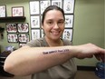 Jenny Gillis shows her new tattoo by tattoo artist Dan Hurst. She got the tattoo on World Down Syndrome Day at Sanctuary Tattoos on Tecumseh Road East March 21, 2018.