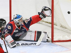 Windsor Spitfires goaltender Mikey DiPietro stretches to make one of his 46 saves on Tuesday against the Sarnia Sting in a 3-1 win at the WFCU Centre that evened the best-of-seven Western Conference quarter-final series at 2-2.