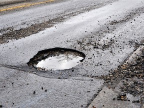 A road damaged by rain,snow, or the freeze/thaw cycle is in need of maintenance.