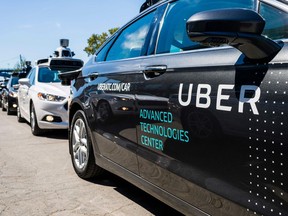 (FILES) In this file photo taken on September 13, 2016, pilot models of the Uber self-driving car are displayed at the Uber Advanced Technologies Center in Pittsburgh, Pennsylvania.