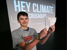 Carlo Desantis, a Grade 8 student at St Gabriel Elementary School displays a rain gauge on Tuesday, March 27, 2018 at Holy Names High School. The Climate Crusaders program was introduced to the students.