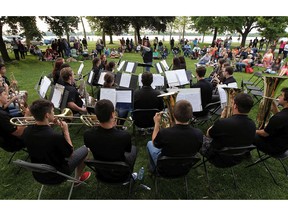 The W. F. Herman Secondary School band performs under the watchful eye of conductor Bernadette Berthelotte at Reaume Park in Windsor on Tuesday, June 2, 2015.