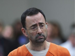 FILE - In this Nov. 22, 2017, file photo, Dr. Larry Nassar, 54, appears in court for a plea hearing in Lansing, Mich. Nassar was sentenced to decades in prison for sexually assaulting young athletes for years under the guise of medical treatment.