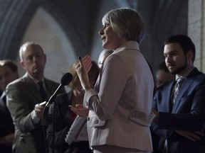 Employment, Workforce Development and Labour Minister Patricia Hajdu speaks with media in the foyer of the House of Commons on Parliament Hill in Ottawa on January 29, 2018. It was Valentine's Day when an Alberta church was told its application for Canada Summer Jobs program funding wasn't complete. The "I attest" box on the application had to be checked and the document signed. Except it was. What happened to the Edmonton-area church is a sign of what critics say is the government's hard line on the conditions placed on funding through the popular program, particularly stipulations that groups respect reproductive rights, such as abortion, even if the applicants expresses concerns about the policy change but still checks the right boxes and signs the forms.