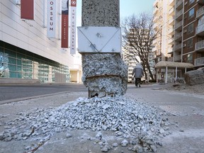 The crumbling base of a light pillar along Pitt Street East is shown on Tuesday March 20, 2018. A downtown hotel manager is concerned about the danger it poses to pedestrians and motorists.