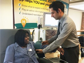 Dr. Amit Bagga, nephrologist at Windsor Regional hospital demonstrates the dialysis machine on patient Ann-Marie Hall, on March 8, 2017.