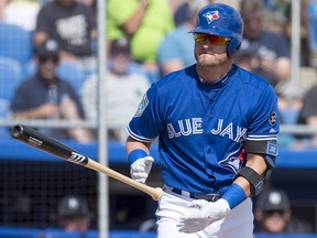 Toronto Blue Jays Josh Donaldson tosses his bat as he walks to first base against the New York Yankees in Dunedin, Fla., Tuesday, Feb. 27, 2018. (THE CANADIAN PRESS/Frank Gunn)