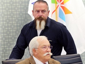 Essex town Coun. Randy Voakes walks by Mayor Ron McDermott after he was asked to leave a Sept. 5, 2017, meeting following council's receipt of an integrity commissioner's report.