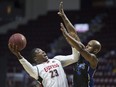 Windsor's Shaquille Keith, left, takes a shot while Kitchener-Waterloo's Tramar Sutherland defends in NBLC action between the Windsor Express and the Kitchener-Waterloo Titans at the WFCU Centre on, Feb. 23, 2018.