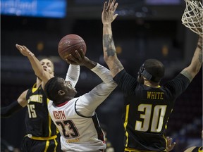 Royce White, right, seen in action last season with the London Lightning against the Windsor Express, will not be joining the team.