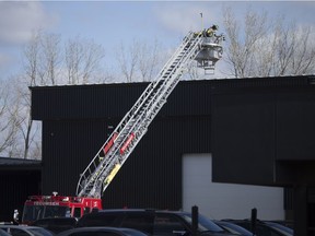 Firefighters with Tecumseh Fire work at the scene of an industrial fire at JNM Tool and Manufacturing Inc. in Oldcastle on March 15, 2018.