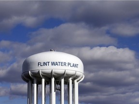 FILE - In this March 21, 2016 file photo, the Flint Water Plant water tower is seen in Flint, Mich.