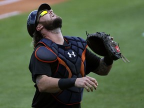 Major League Baseball free agent catcher Jarrod Saltalamacchia tracks down a foul pop out during an scrimmage game against the East Japan Railway Company on Feb. 27, 2018, in Bradenton, Fla.