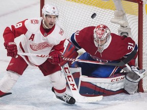 Detroit Red Wings left wing Justin Abdelkader (8) moves in on Montreal Canadiens goaltender Carey Price (31) during third period NHL hockey action in Montreal, Monday, March 26, 2018.